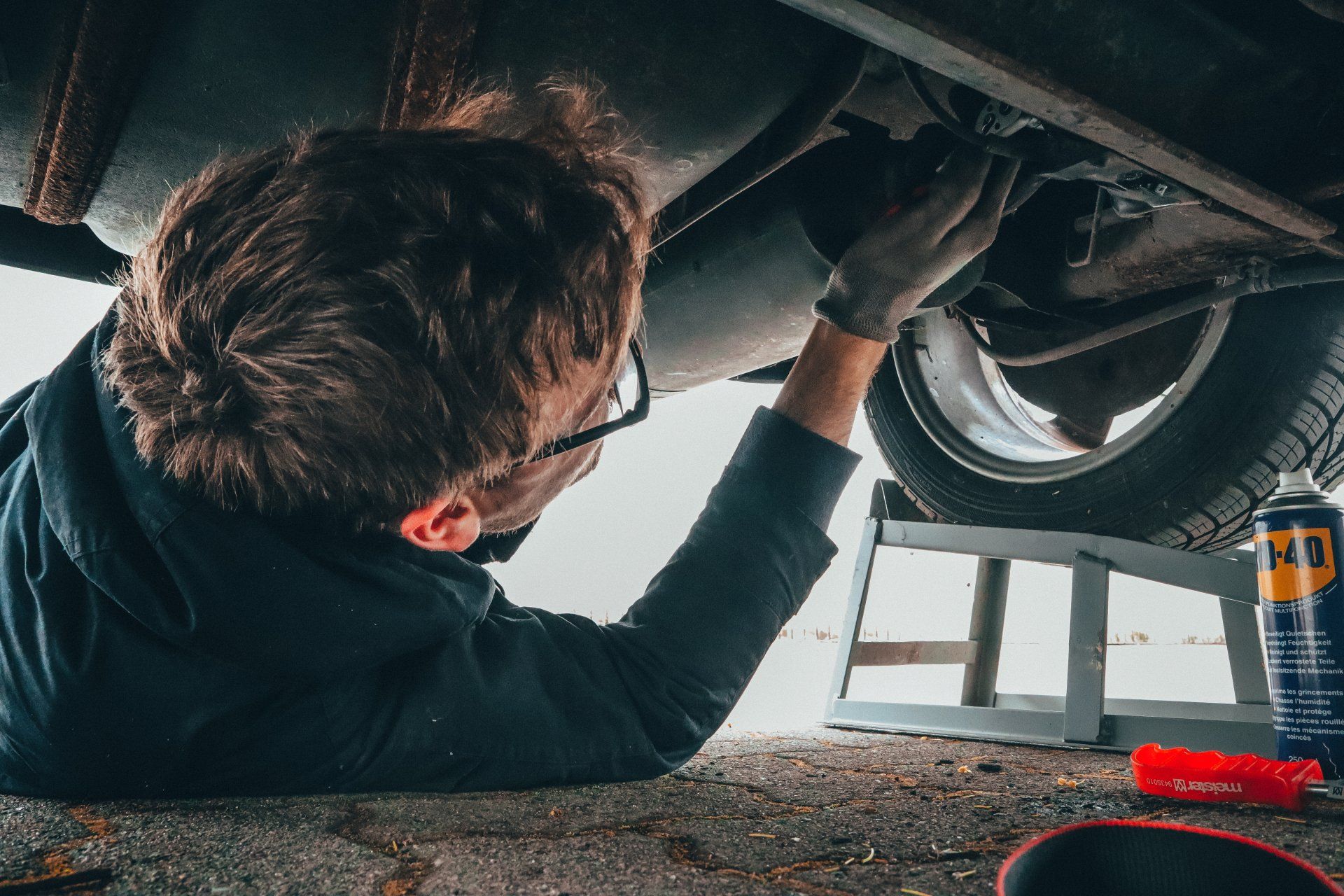 Mechanic working under vehicle
