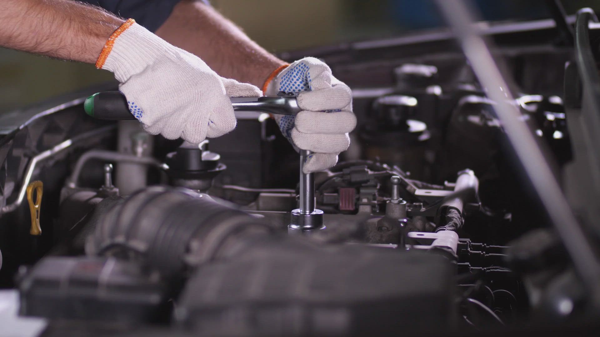 Mechanic hands with wrench